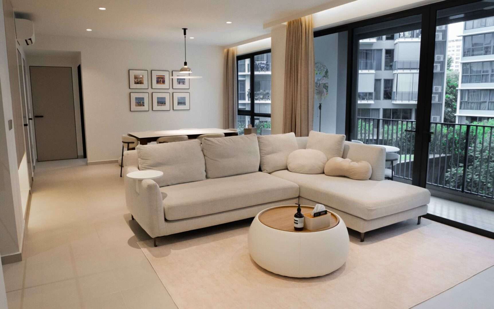 Spacious living room with TV feature wall and balcony access